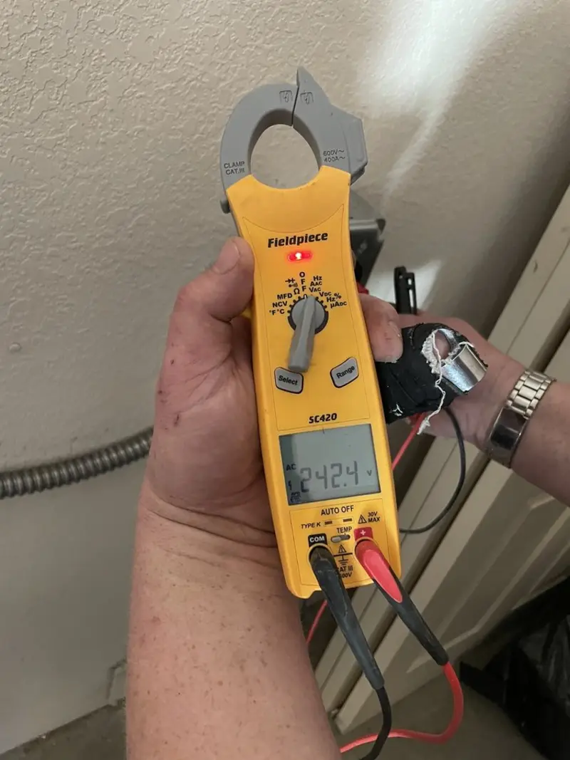 Voltage testing with clamp meter during Ceiling Fan Installation in Manhattan Beach